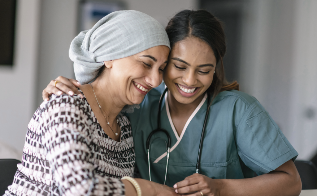 A woman and nurse smiling