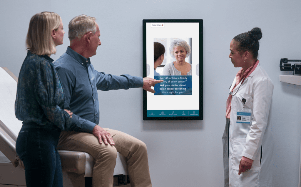 Patient using exam room engagement technology to communicate with their provider.